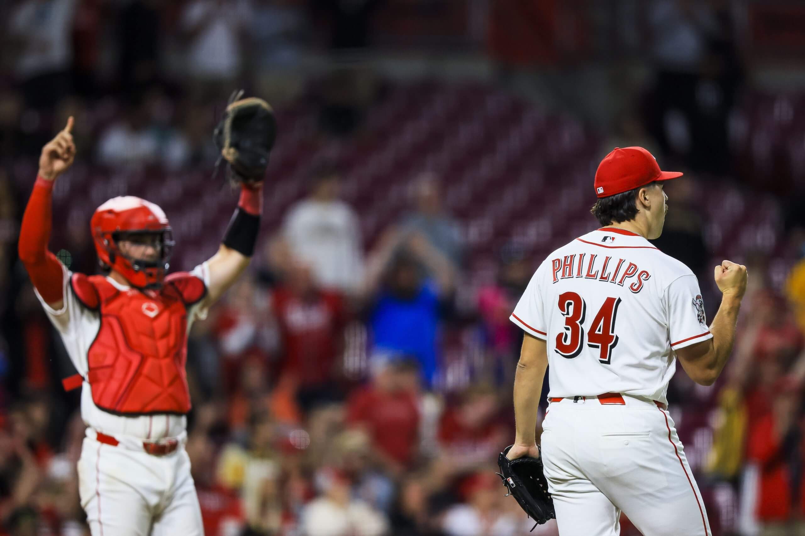Cincinnati Reds relief pitcher Connor Phillips celebrates his first major-league save after a victory over the Pittsburgh Pirates at Great American Ball Park on March 30, 2026.