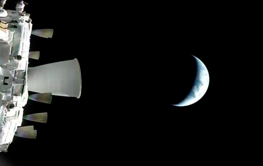 caption: In this photo provided by NASA, a view of the Earth from NASA's Orion spacecraft as it orbits above the planet during the Artemis II test flight, on Thursday, April 2, 2026.