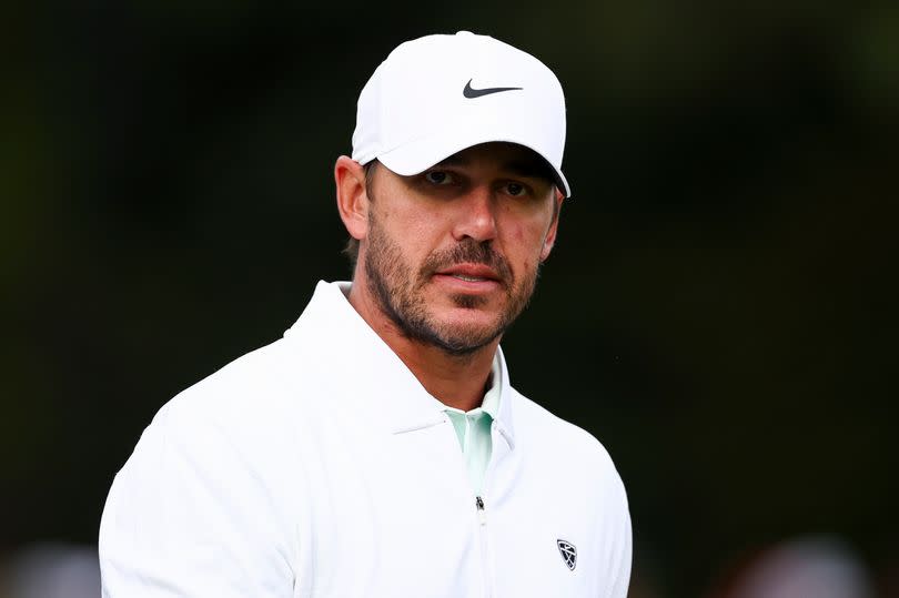 Brooks Koepka looks on while at the tournament practice area during a practice round prior to the 2026 Masters Tournament