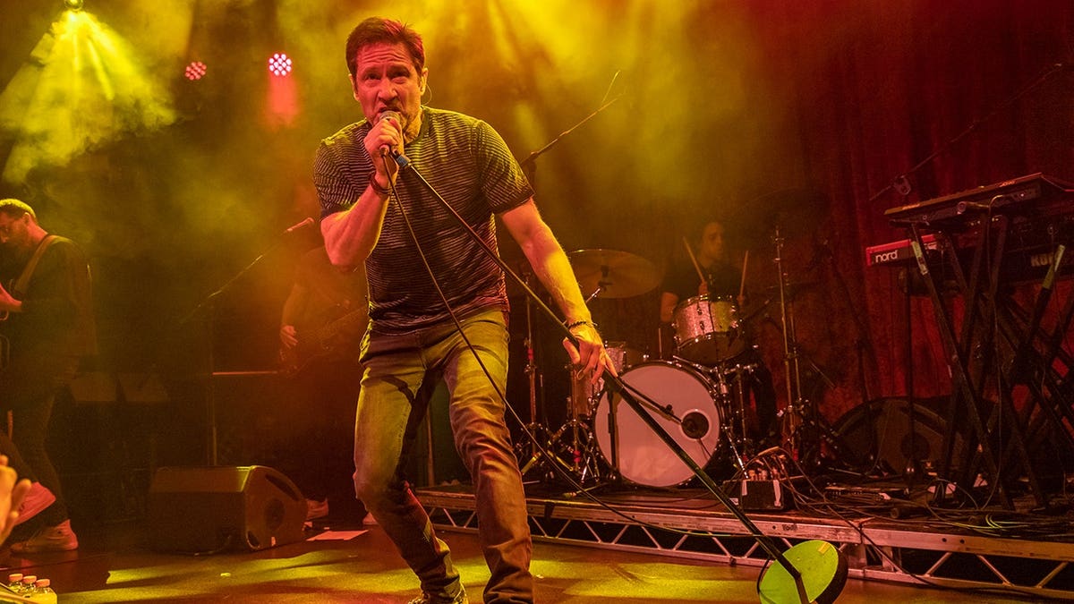 David Duchovny singing on stage at the Academy music venue in Dublin