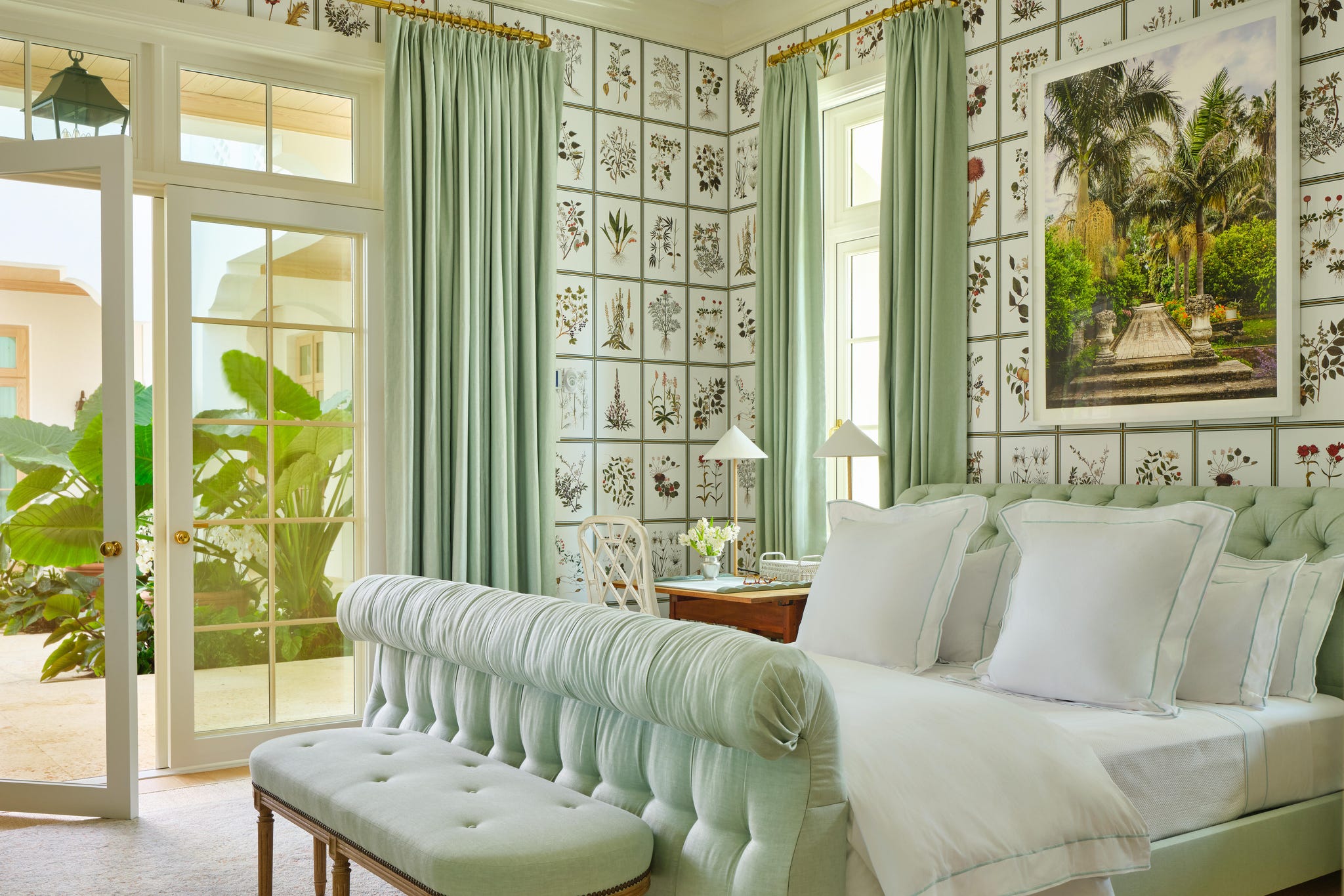 Cozy bedroom with floral wallpaper and green accents