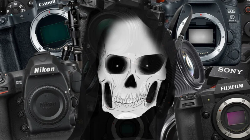 A digital illustration of a white skull in the center, surrounded by various professional camera bodies from brands like Canon, Nikon, Sony, and Fujifilm. The cameras appear slightly overlapping behind the skull.