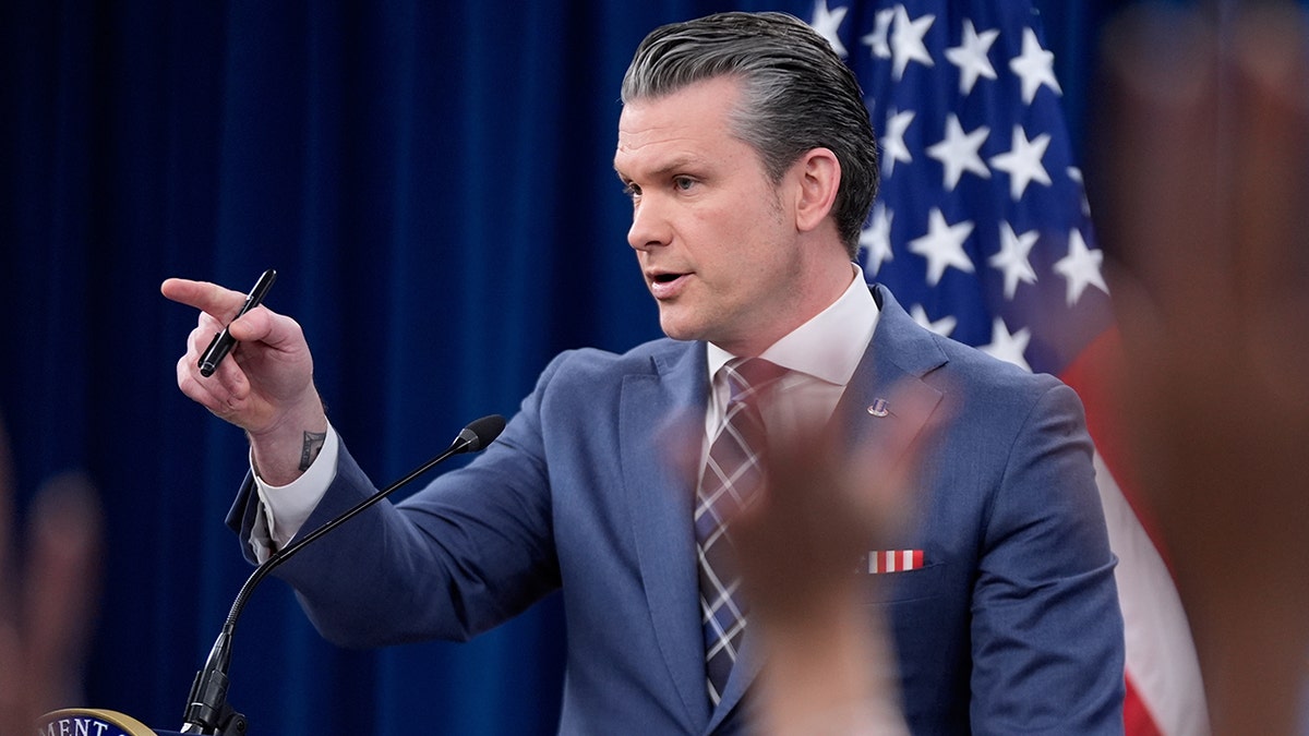 Pete Hegseth speaking to members of the media at a Pentagon press briefing.
