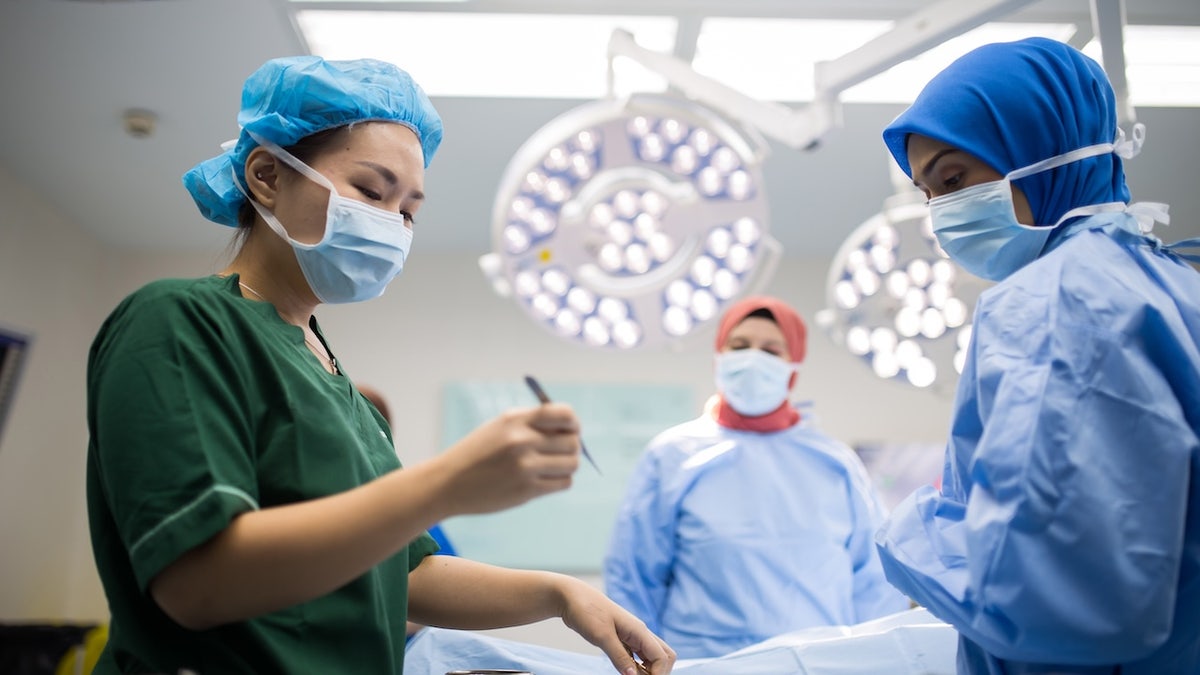 Doctors and nurses performing surgery