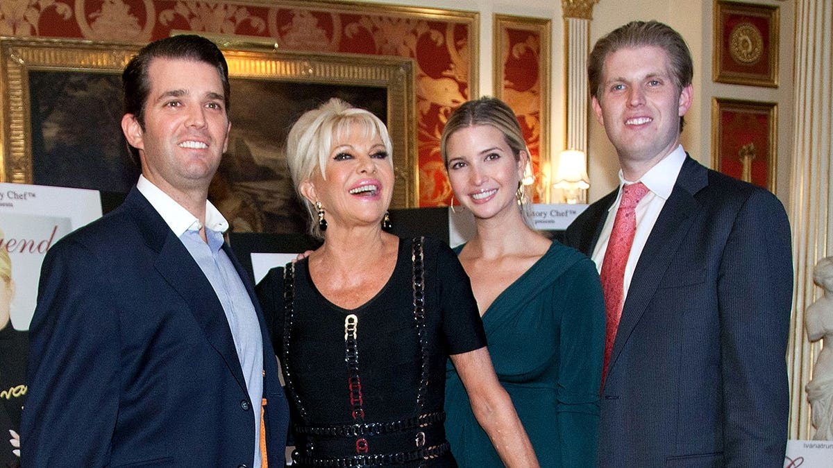 Donald Trump Jr., Ivana Trump, Ivanka Trump, and Eric Trump standing together at an event.