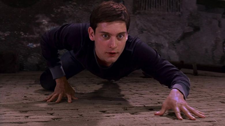 Peter Parker (Tobey Maguire) crawling in 