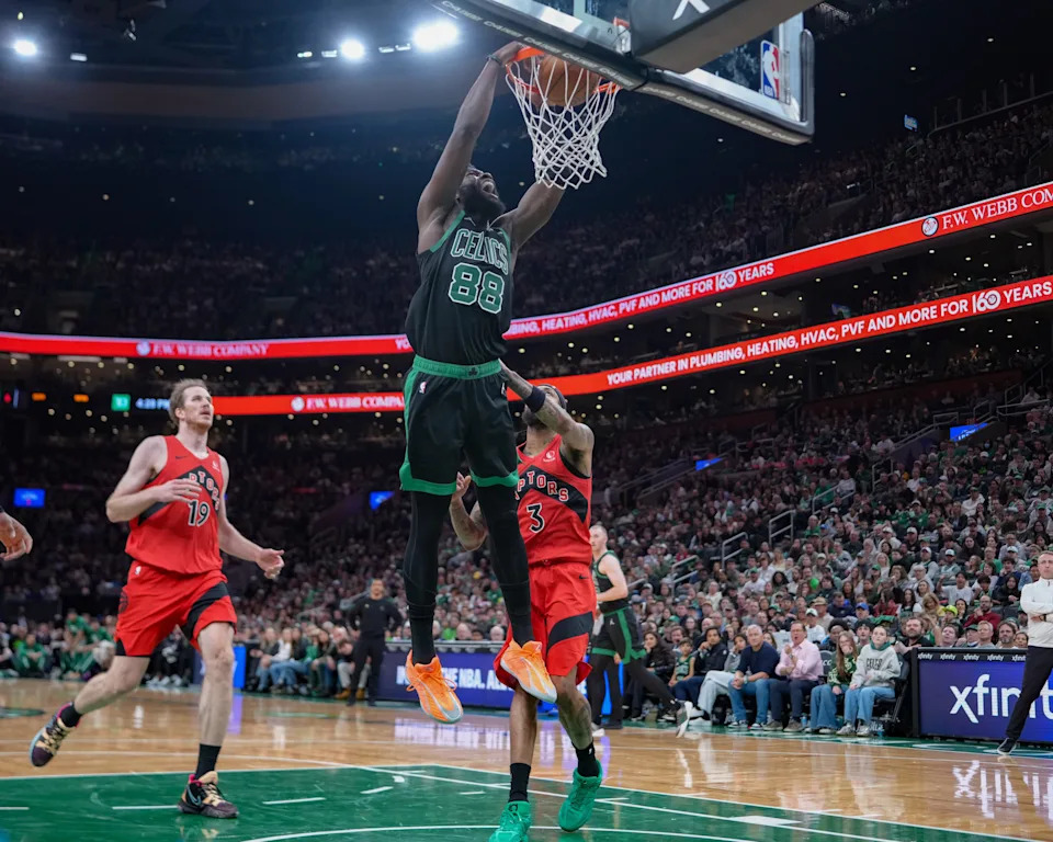 Apr 5, 2026; Boston, Massachusetts, USA; Boston Celtics center Neemias Queta (88) dunks the ball against Toronto Raptors forward Brandon Ingram (3) during the first half at TD Garden. Mandatory Credit: Gregory Fisher-Imagn Images