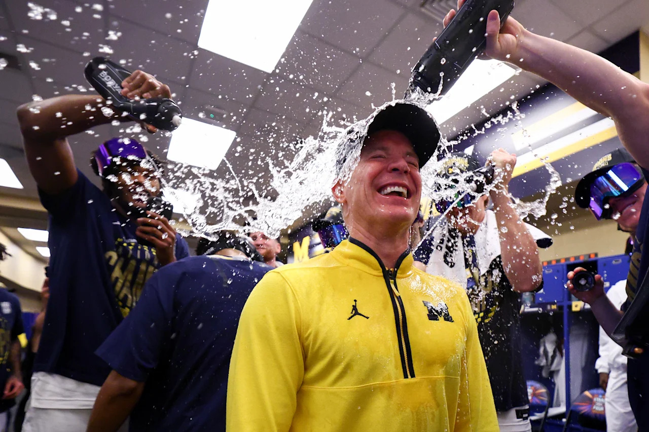 INDIANAPOLIS, INDIANA - APRIL 06: Head Coach Dusty May of the Michigan Wolverines is doused with water in the lockerroom after Michigan defeated the UConn Huskies in the National Championship of the 2026 NCAA Men's Basketball Tournament at Lucas Oil Stadium on April 06, 2026 in Indianapolis, Indiana. (Photo by Jamie Schwaberow/NCAA Photos via Getty Images)