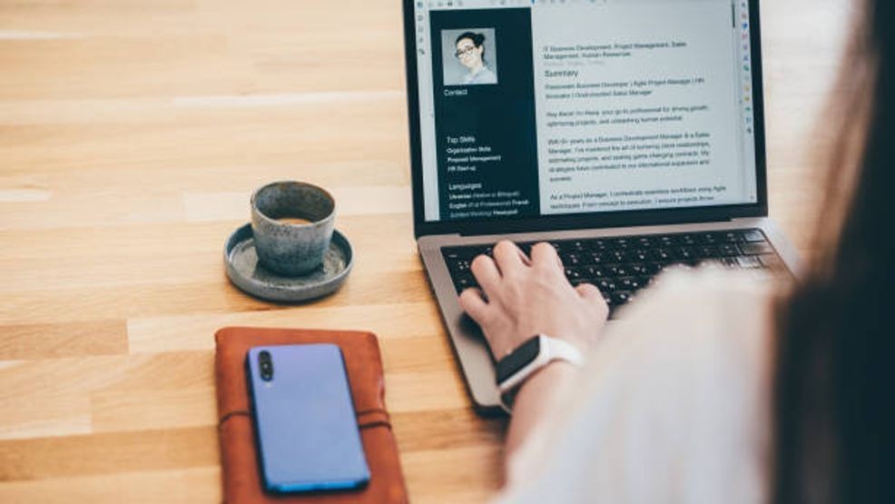 Woman searching for job online. Getty Images.