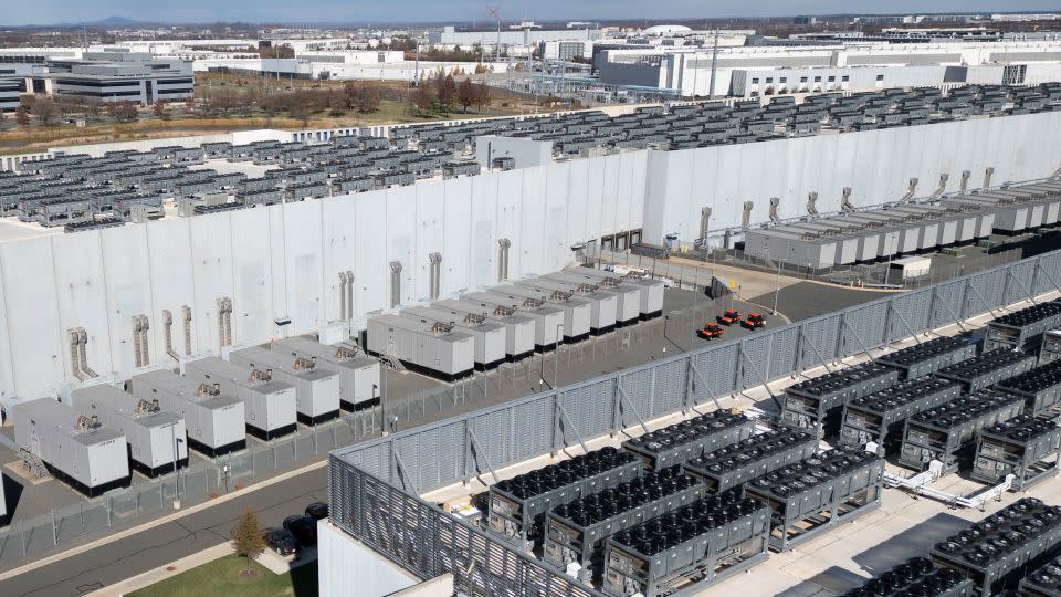Cooling vent fans on the roof of a Digital Realty data center in Ashburn, Virginia on November 12, 2025. - Andrew Caballero-Reynolds/AFP/Getty Images