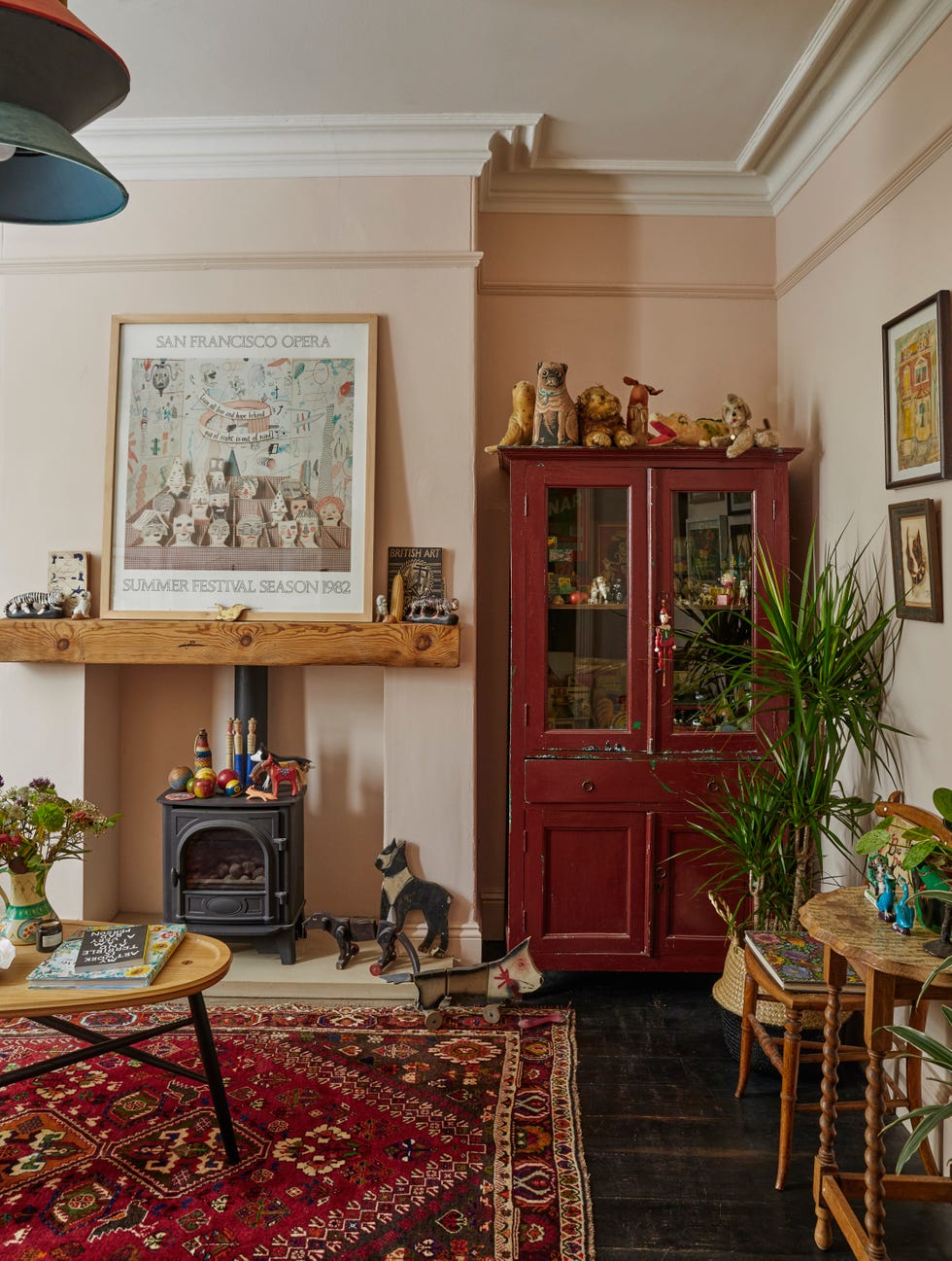a living room painted in farrow and ball's pink ground a warm, plaster pink