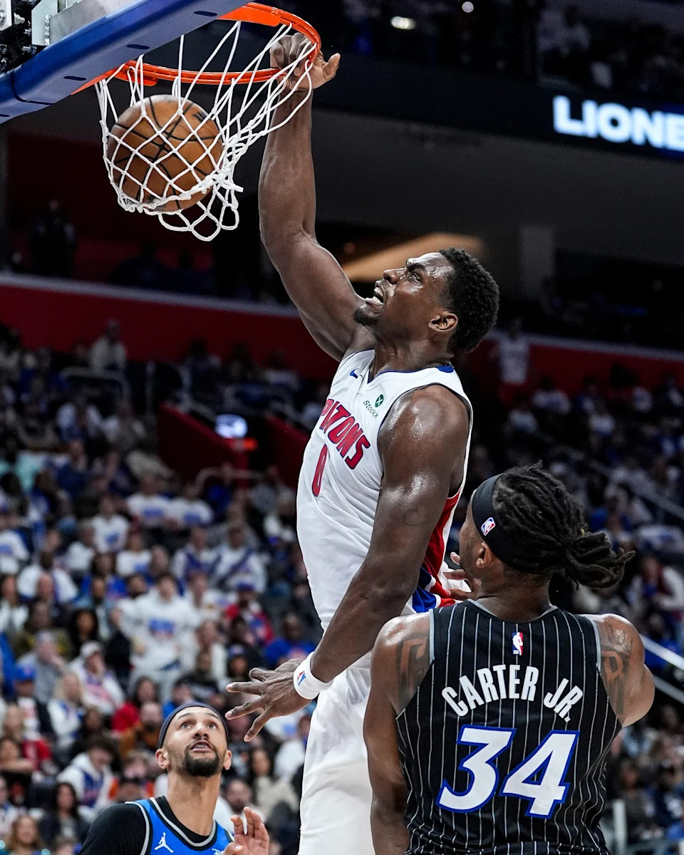 Detroit Pistons center Jalen Duren dunks against Orlando Magic center Wendell Carter Jr. during the first half of Game 1 of the first round of the NBA playoffs at Little Caesars Arena in Detroit on Sunday, April 19, 2026.