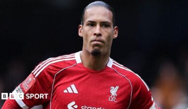 Liverpool captain Virgil van Dijk looks on as he stands with his hands resting on his hips after Liverpool's FA Cup defeat by Manchester City