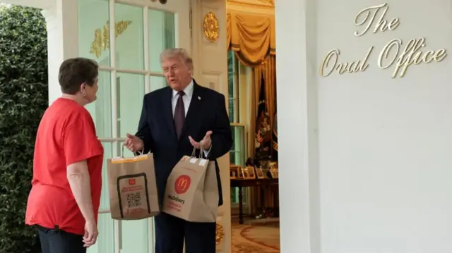 Trump seen holding two bags of McDonald's food