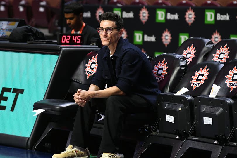 Jonathan Kolb, General Manager of the New York Liberty, watches Liberty players warm up before a WNBA game between the New York Liberty and the Connecticut Sun on August 3, 2025, at Mohegan Sun Arena in Uncasville, CT