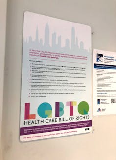 Sign on wall listing New York's 'LGBTQ HEALTH CARE BILL OF RIGHTS'