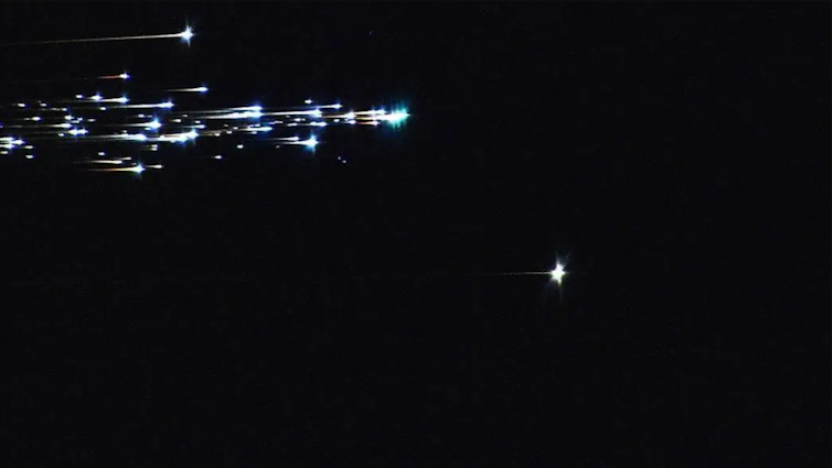 A streak of bright lights against a black background.