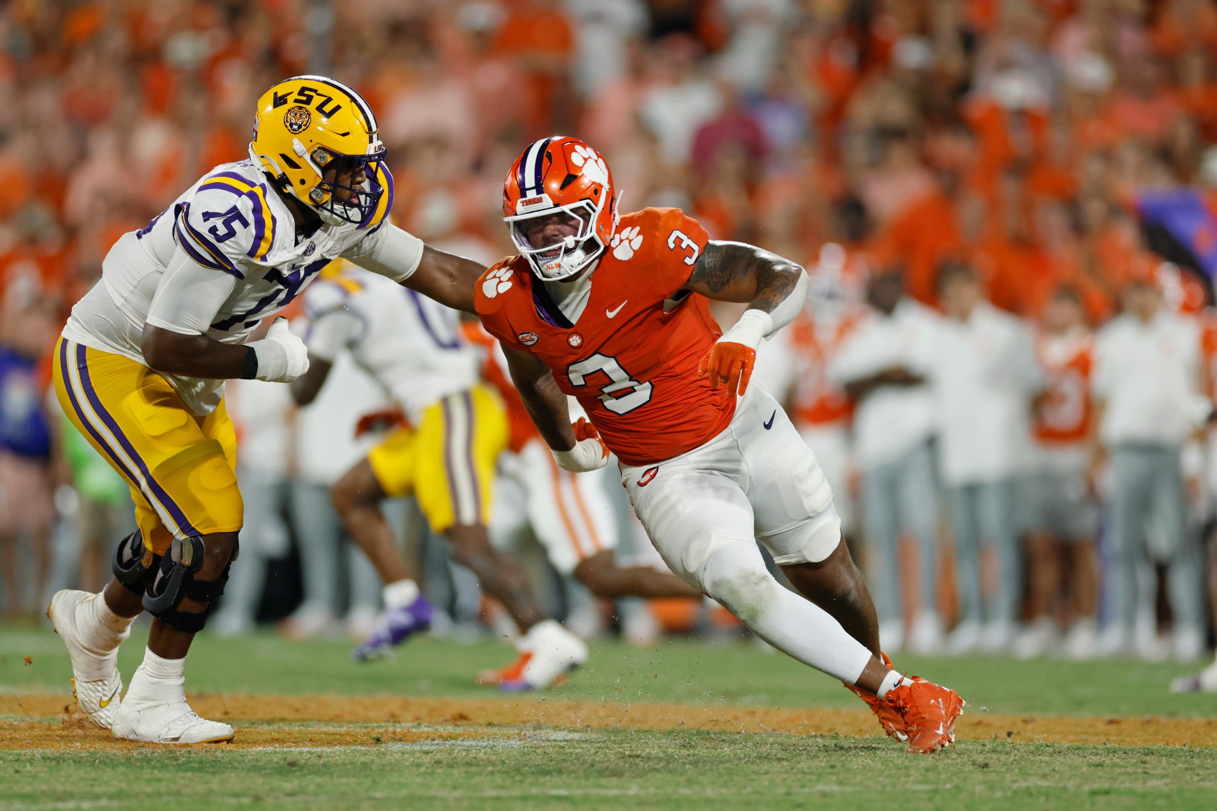 CLEMSON, SC - AUGUST 30: T.J. Parker #3 of the Clemson Tigers rushes on defense while being blocked by Weston Davis #75 of the LSU Tigers during a college football game on August 30, 2025 at Memorial Stadium in Clemson, South Carolina. (Photo by Joe Robbins/Icon Sportswire via Getty Images)