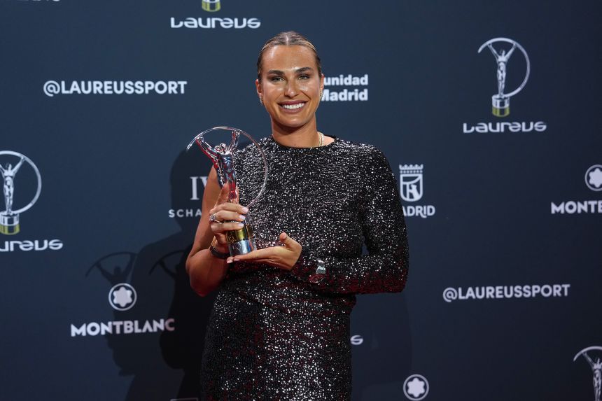 Belarusian tennis player Aryna Sabalenka poses with the Laureus World Sportswoman of the Year award.