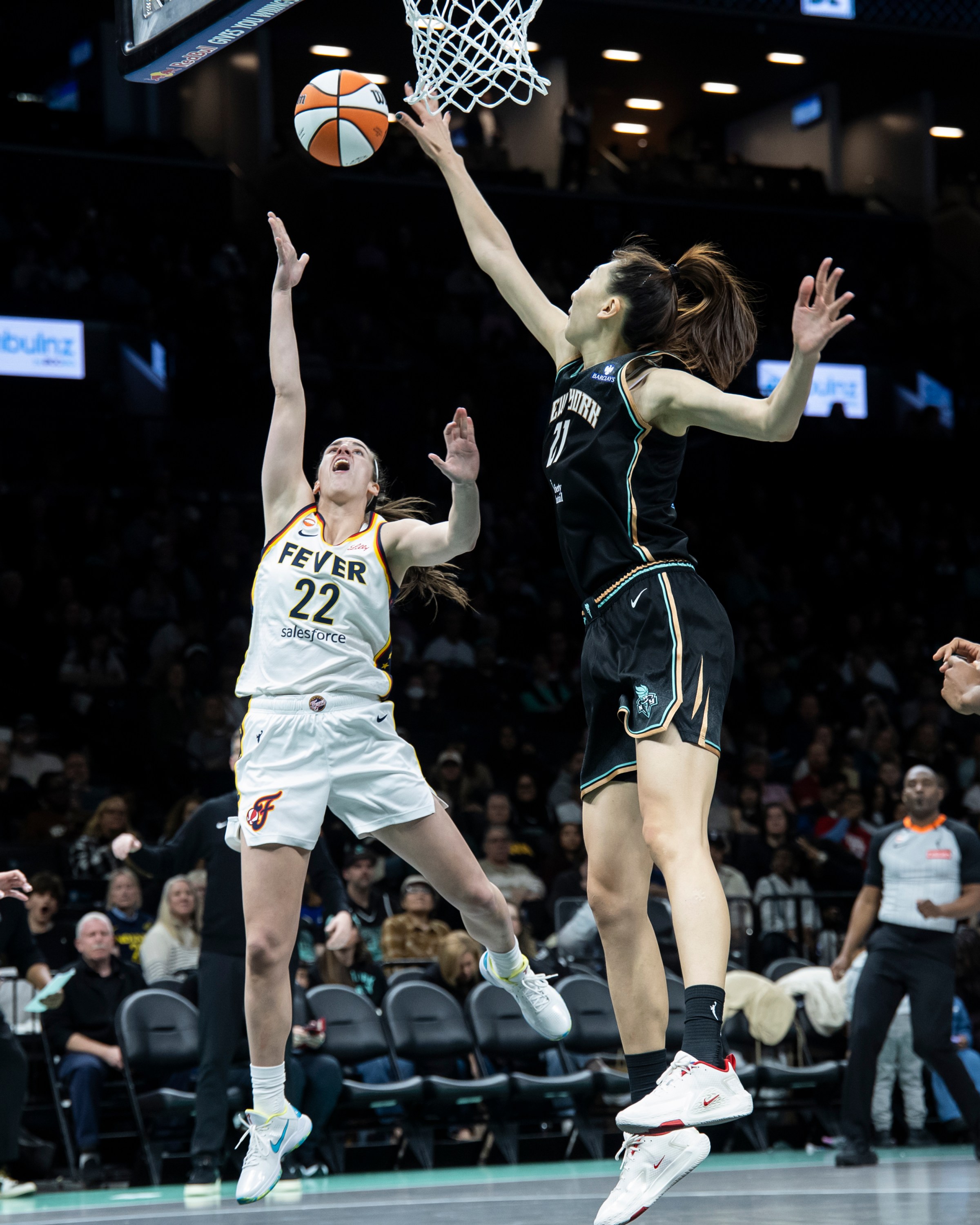 BROOKLYN, NEW YORK - APRIL 25: Caitlyn Clark #22 of the Indiana Fever shoots against Han Xu #21 of the New York Liberty at Barclays Center on April 25, 2026 in Brooklyn, New York. NOTE TO USER: User expressly acknowledges and agrees that, by downloading and or using this Photograph, user is consenting to the terms and conditions of the Getty Images License Agreement. (Photo by Michelle Farsi/Getty Images)