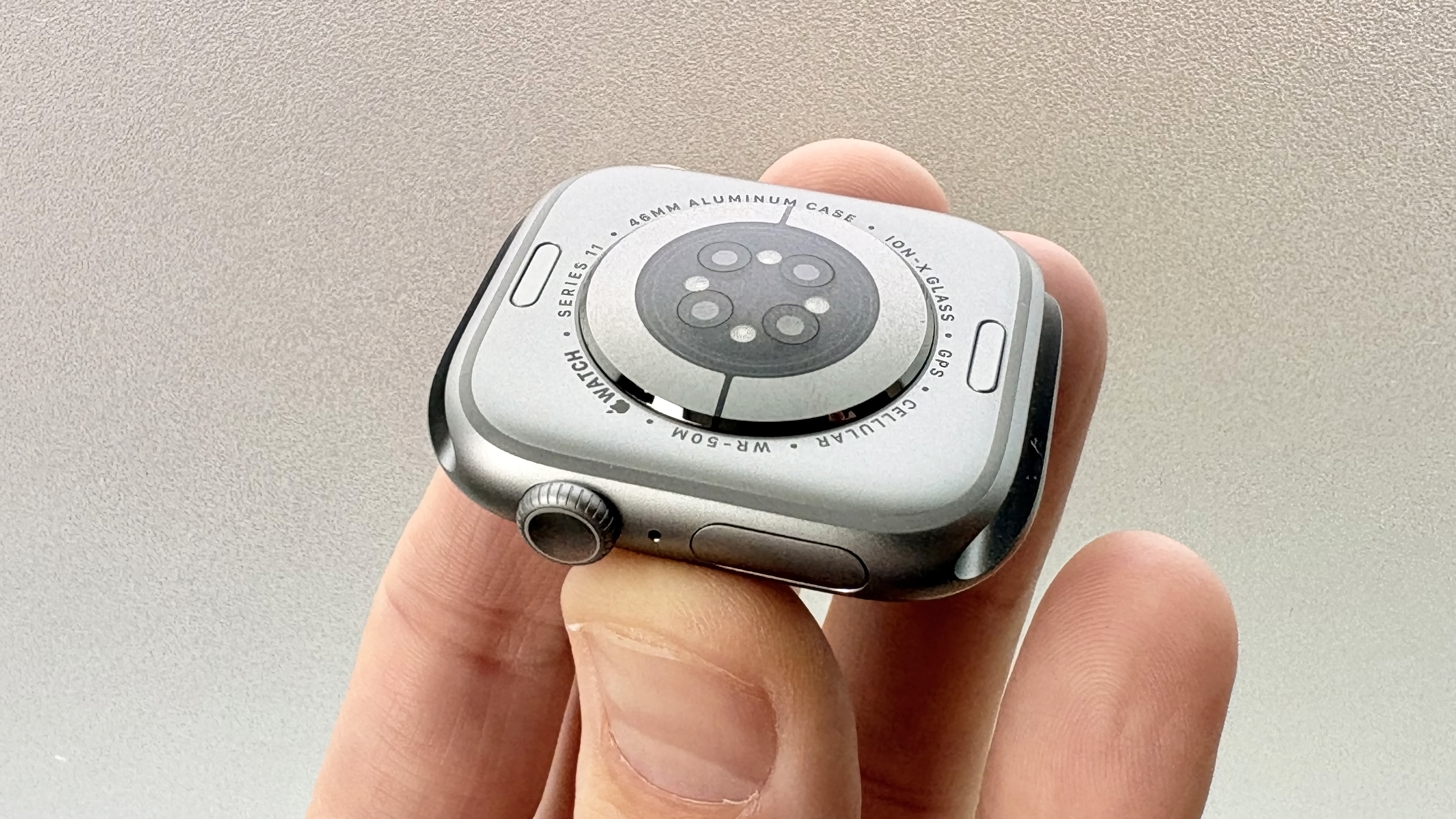 Close-up of the rear sensor array on the Apple Watch Series 11