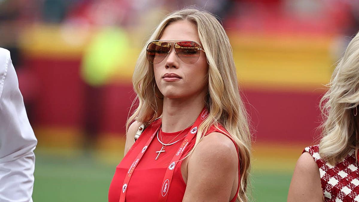 Gracie Hunt standing on the sidelines at GEHA Field at Arrowhead Stadium in Kansas City, Missouri