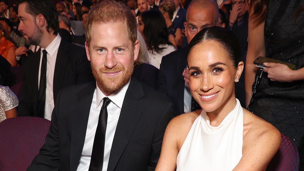 Prince Harry and Meghan, Duchess of Sussex, standing together at the 2024 ESPY Awards in Hollywood