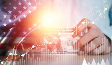 Businessman holding use banknote with USA flag and stock market graph chart for currency exchange and global trade forex concept.