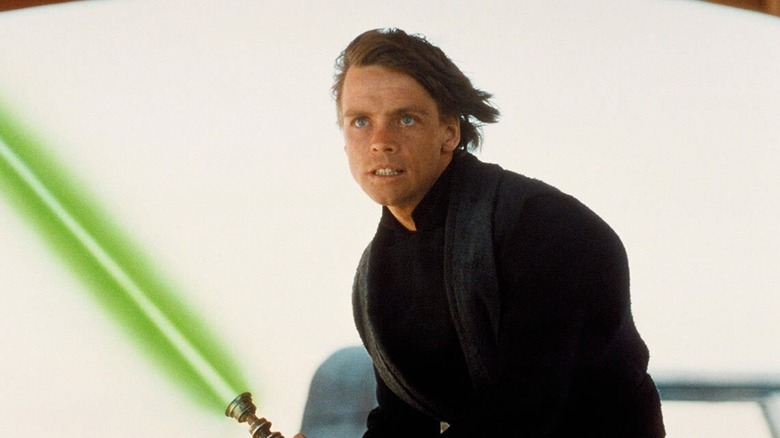 Mark Hamill as Luke Skywalker with his green lightsaber on Jabba's barge in Star Wars: Return of the Jedi
