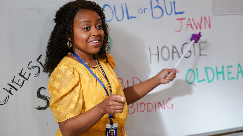 Janine Teagues (Quinta Brunson) points to slang terms on a white board in Abbott Elementary