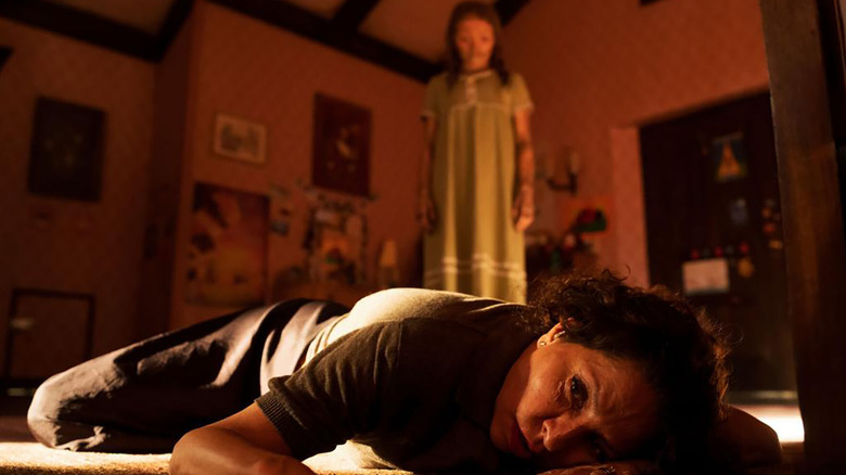 Katie looms ominously over a scared Carmen in Lee Cronin's The Mummy