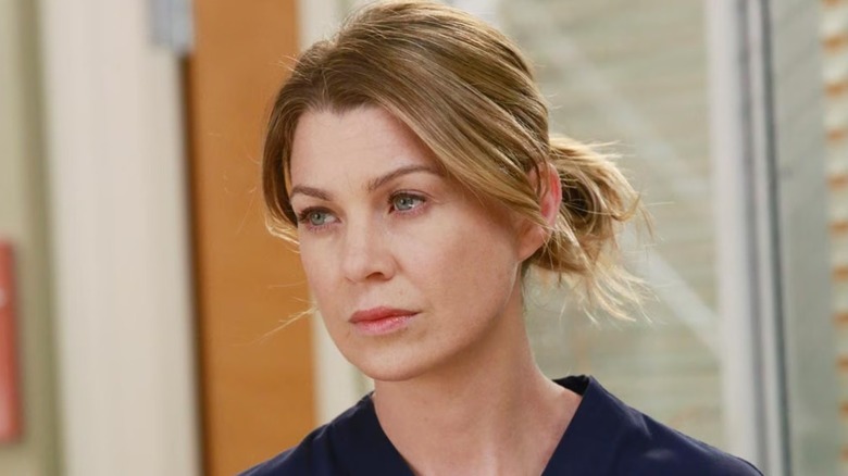 Meredith Grey standing in a hospital room
