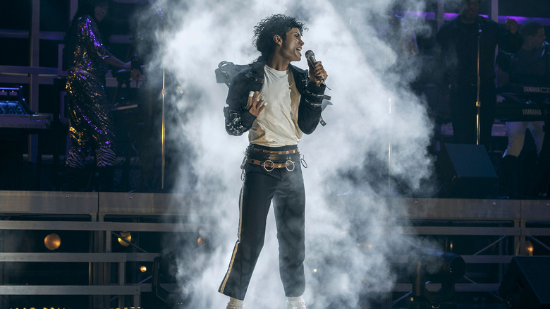 Jaafar Jackson as Michael Jackson performing on stage surrounded by fog in Michael (2026)