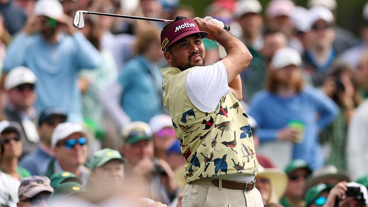 Jason Day playing a shot from the 12th hole tee box at Augusta National Golf Club