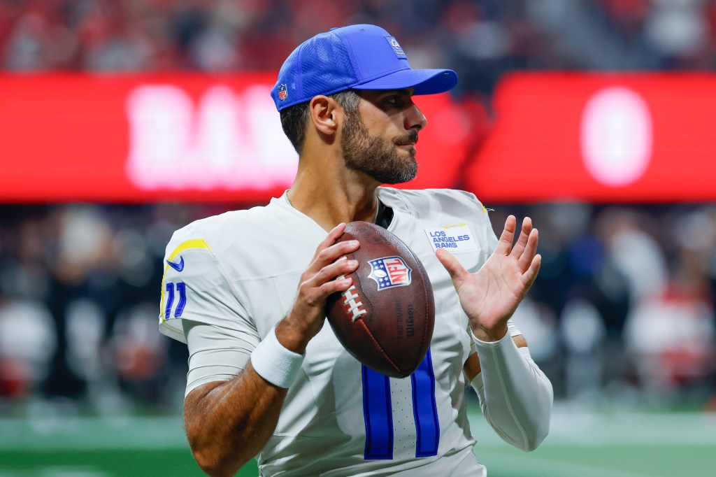 Los Angeles Rams quarterback Stetson Bennett IV preparing to throw the football.