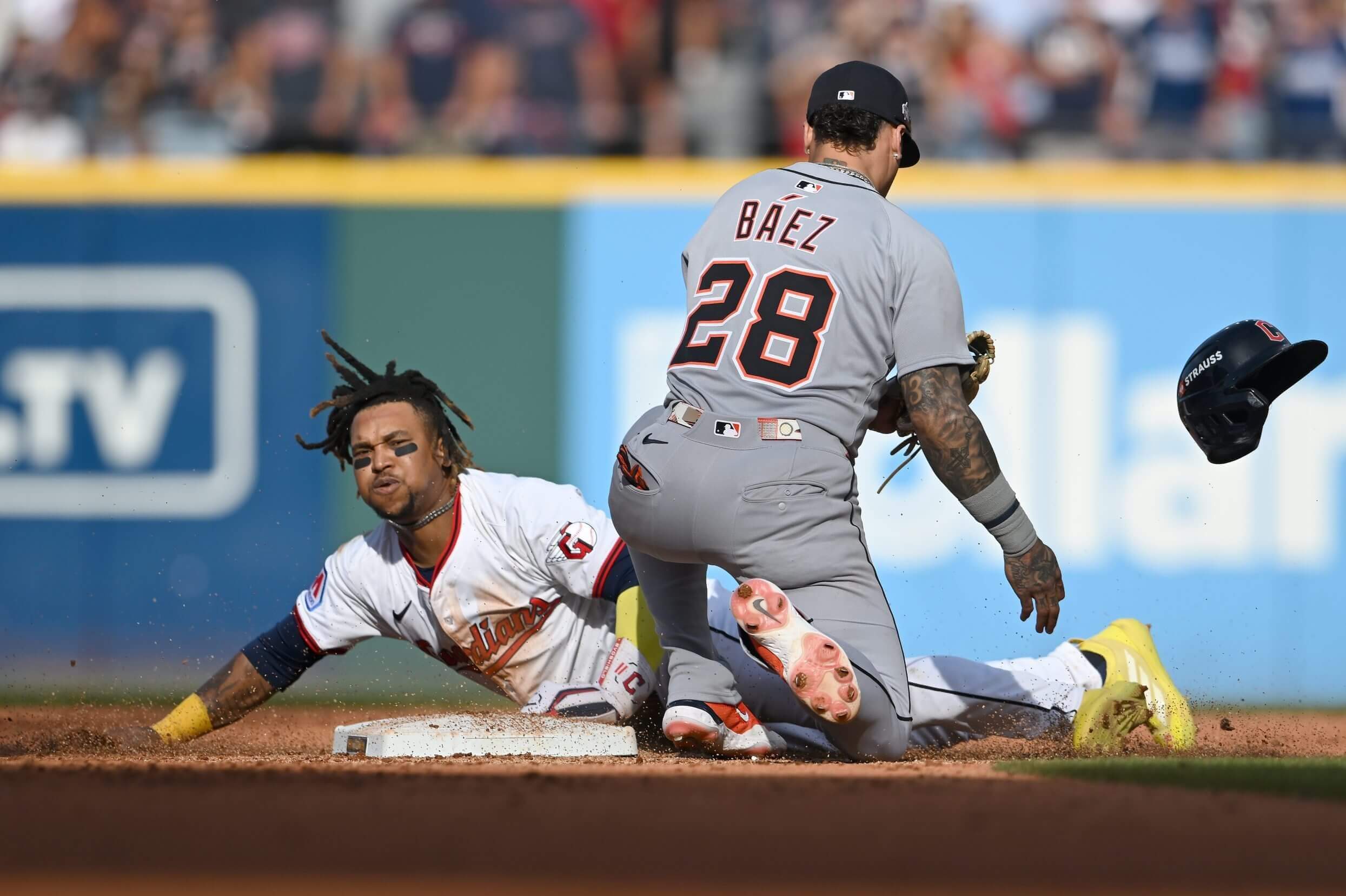 José Ramírez of the Cleveland Guardians is is tagged out by Javier Báez of the Detroit Tigers.