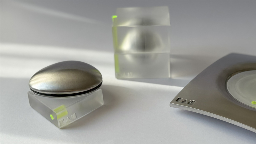 aluminum and acrylic handheld objects frame touch, weight, and movement as design tools - 1