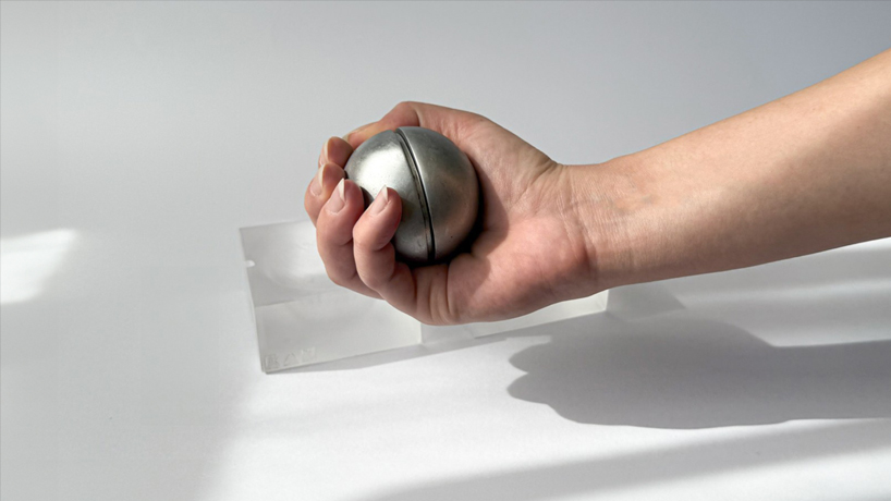 aluminum and acrylic handheld objects frame touch, weight, and movement as design tools - 3