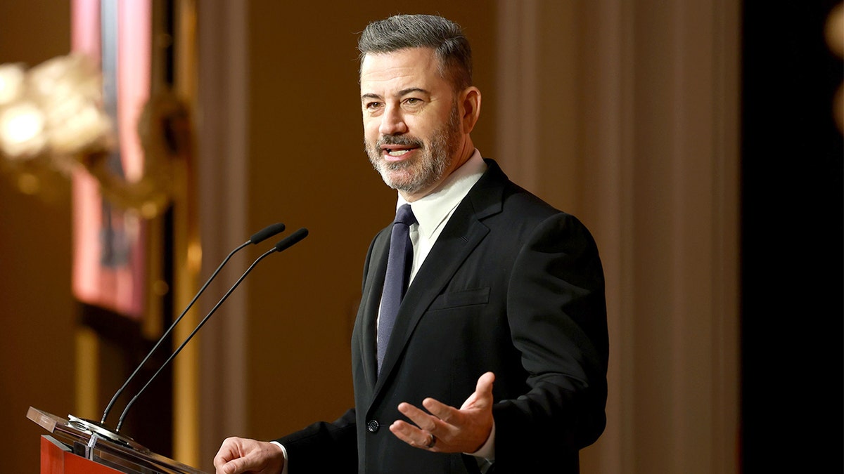 Jimmy Kimmel speaking onstage at The Hollywood Reporter Women In Entertainment event in Beverly Hills