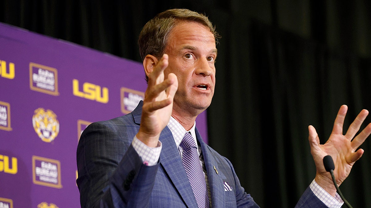 Lane Kiffin speaking at a press conference at Tiger Stadium in Baton Rouge Louisiana