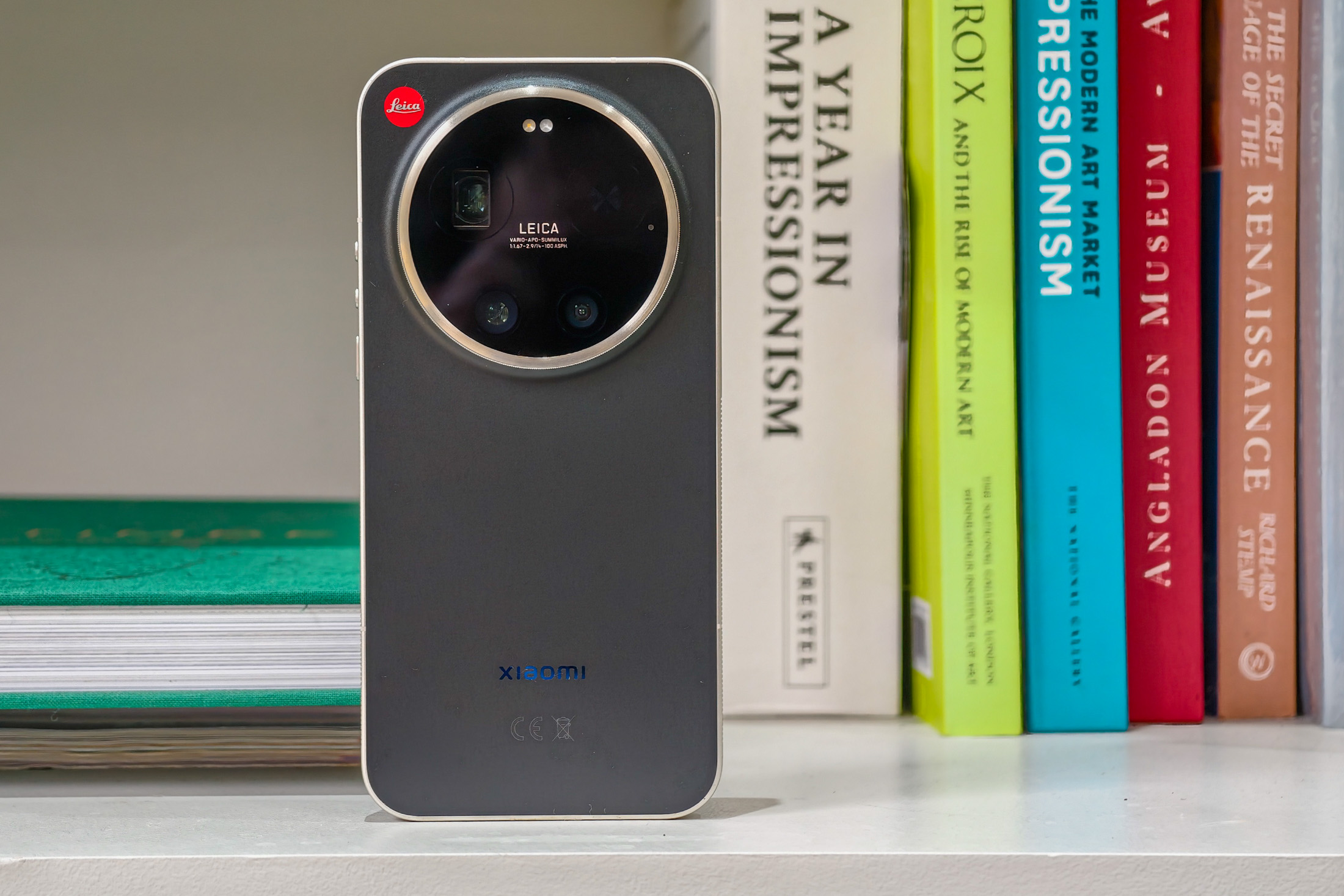 Photo of the Xiaomi Leica Leitzphone on a bookshelf, showing the back of the phone