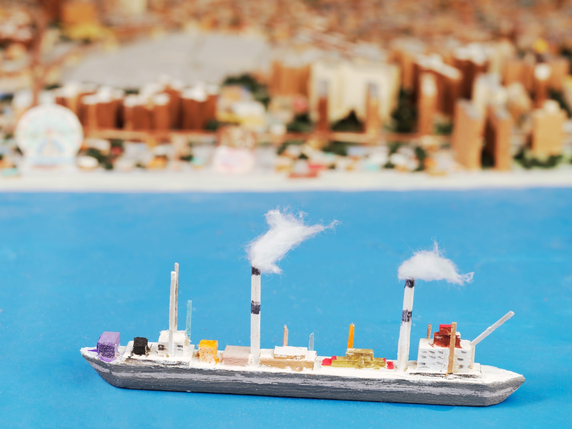 a detail of a steam ship in an expansive, hand-built scale model of New York City