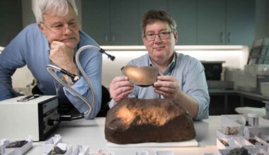Scientists examine the Maryborough meteorite at Melbourne Museum after confirming the heavy stone found in Australia was a meteorite.