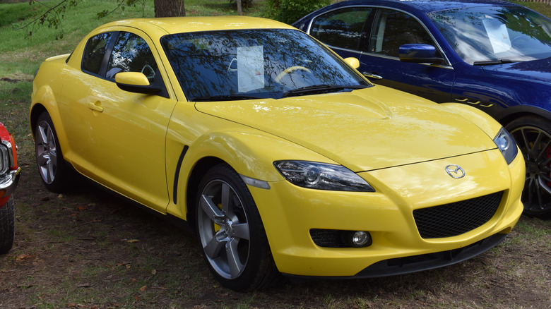 Beesd, the Netherlands - September 12, 2025: a yellow Mazda RX-8