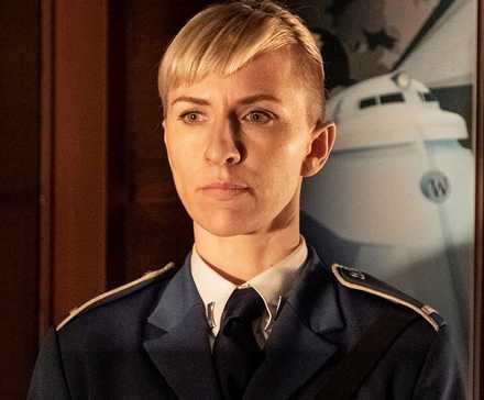 Mickey Sumner as Bess Till looking straight ahead in Snowpiercer
