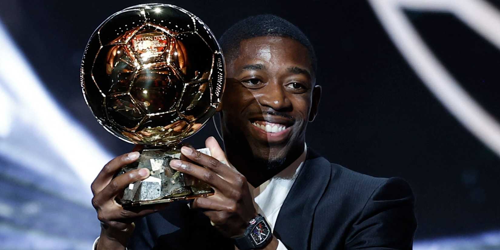 Paris St Germain's Ousmane Dembele celebrates after winning the men's Ballon d'Or award