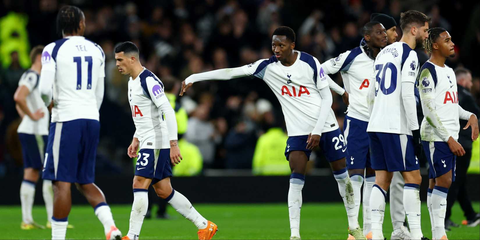 Tottenham Hotspur's Pedro Porro is pushed away by Pape Matar Sarr.