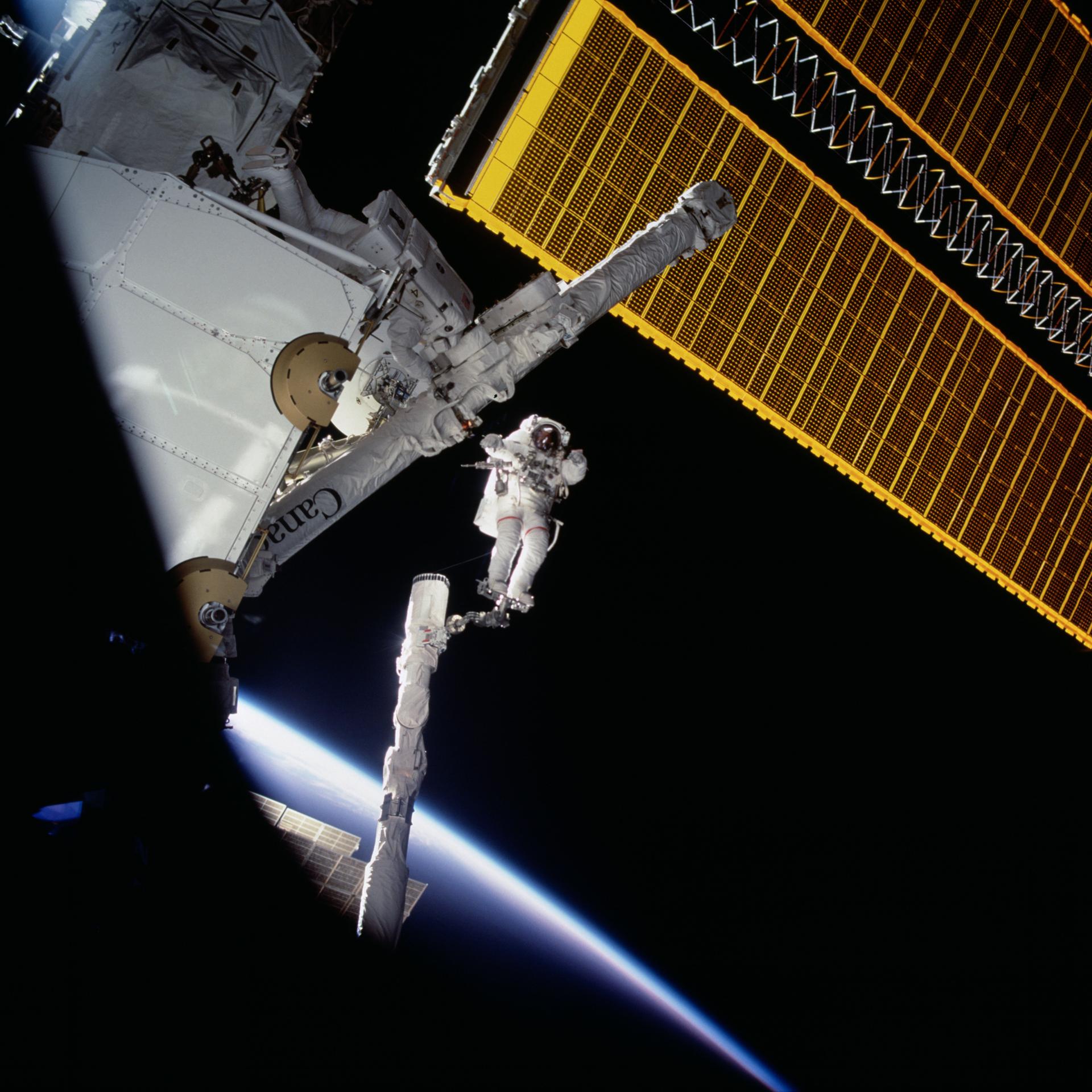 Chris Hadfield (center) on a space walk in 2001.