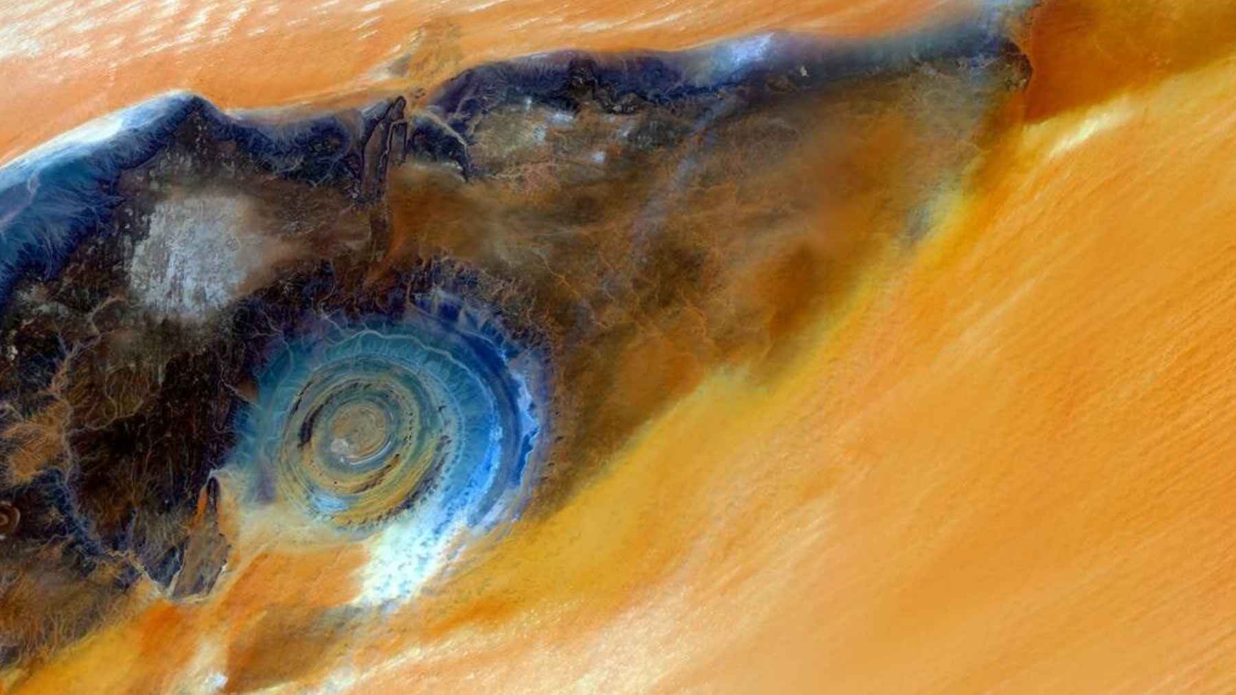 Astronaut view of the Richat Structure, or Eye of the Sahara, showing concentric rings in the Mauritanian desert