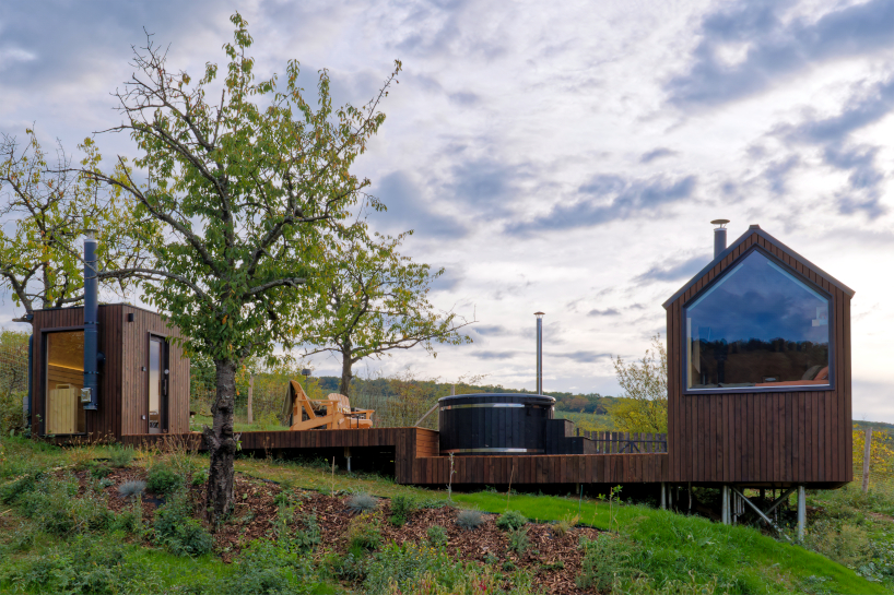 prefabricated timber micro-cabin extends living into the hungarian landscape - 3